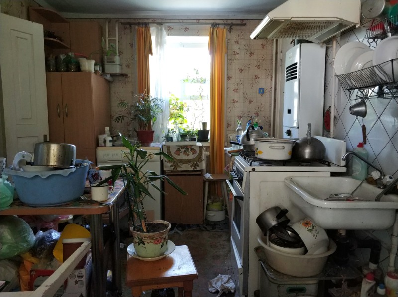 former clients cluttered outdated house